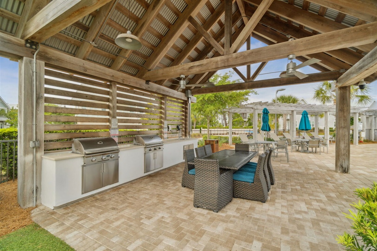 Community grill pavilion with BBQs and seating.