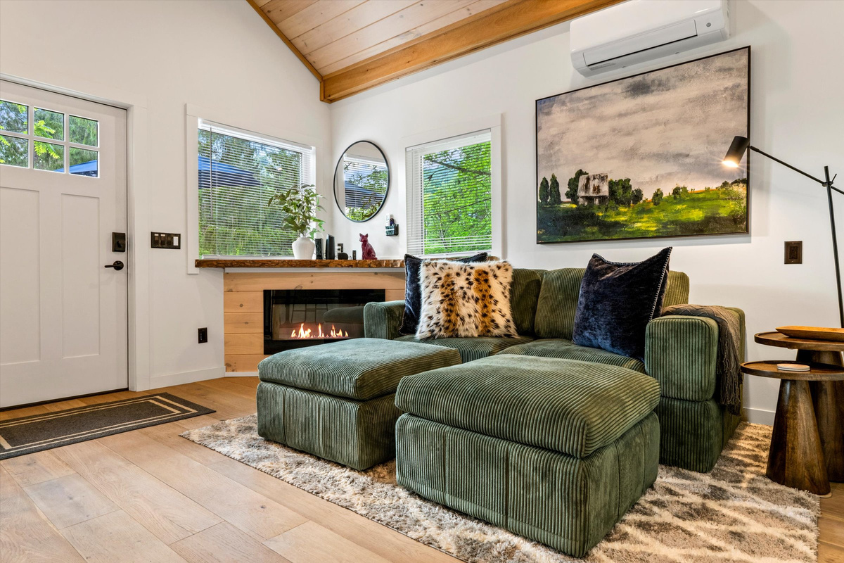 Cozy Living Room with 55-inch Smart TV, Fireplace, and bistro table.