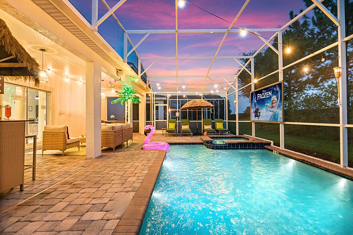 Your tropical oasis awaits! Tiki Torches, stunning tree with LED lights, outdoor string lights, a tiki bar.....whats not to love!