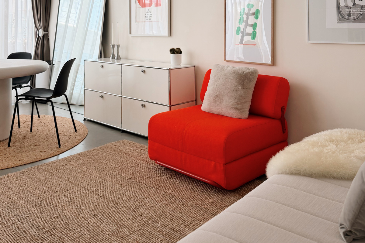 Red chair opens into a single bed, and couch can also be set up as a single bed.