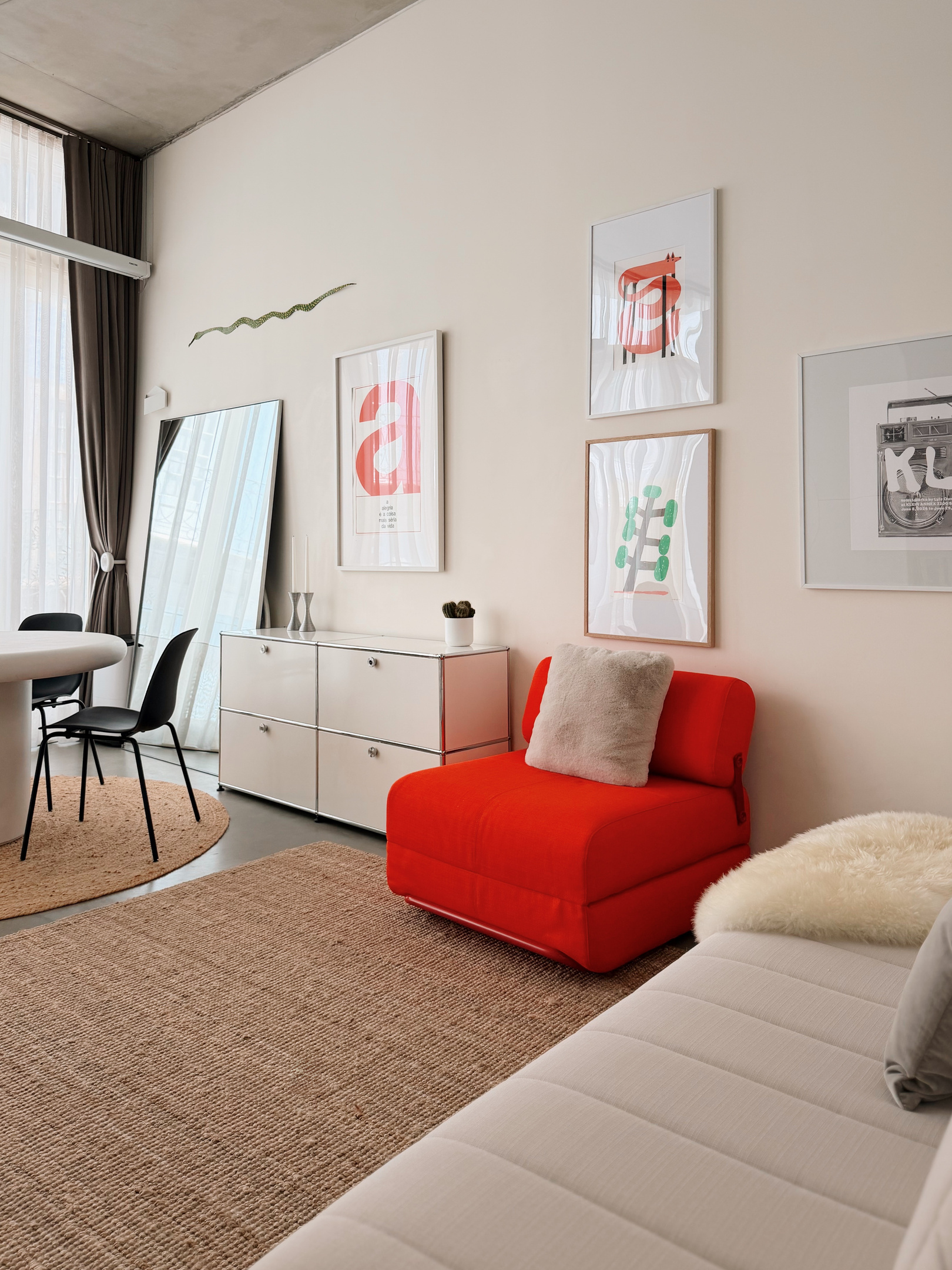 Red chair opens into a single bed, and couch can also be set up as a single bed.