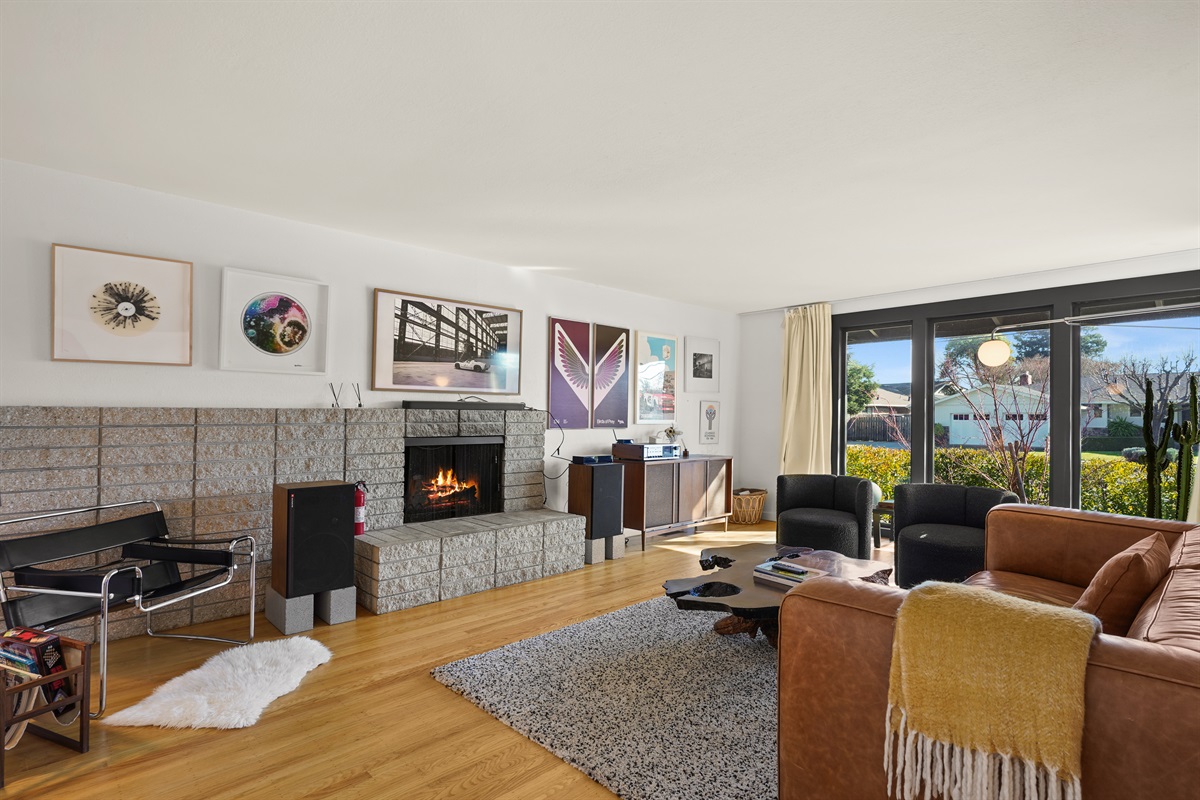 Gather and unwind in the spacious living room featuring comfortable seating, a Smart TV, and an inviting atmosphere perfect for relaxing with family and friends.