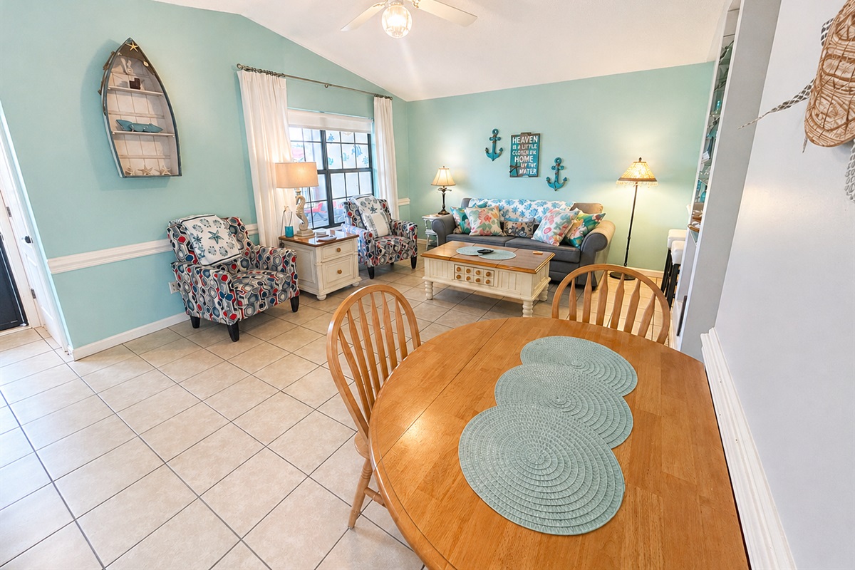 Open concept living area with vaulted ceilings