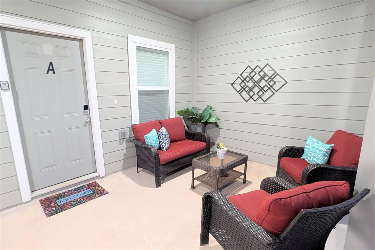 Enjoy the large covered front patio with plush seating. 
