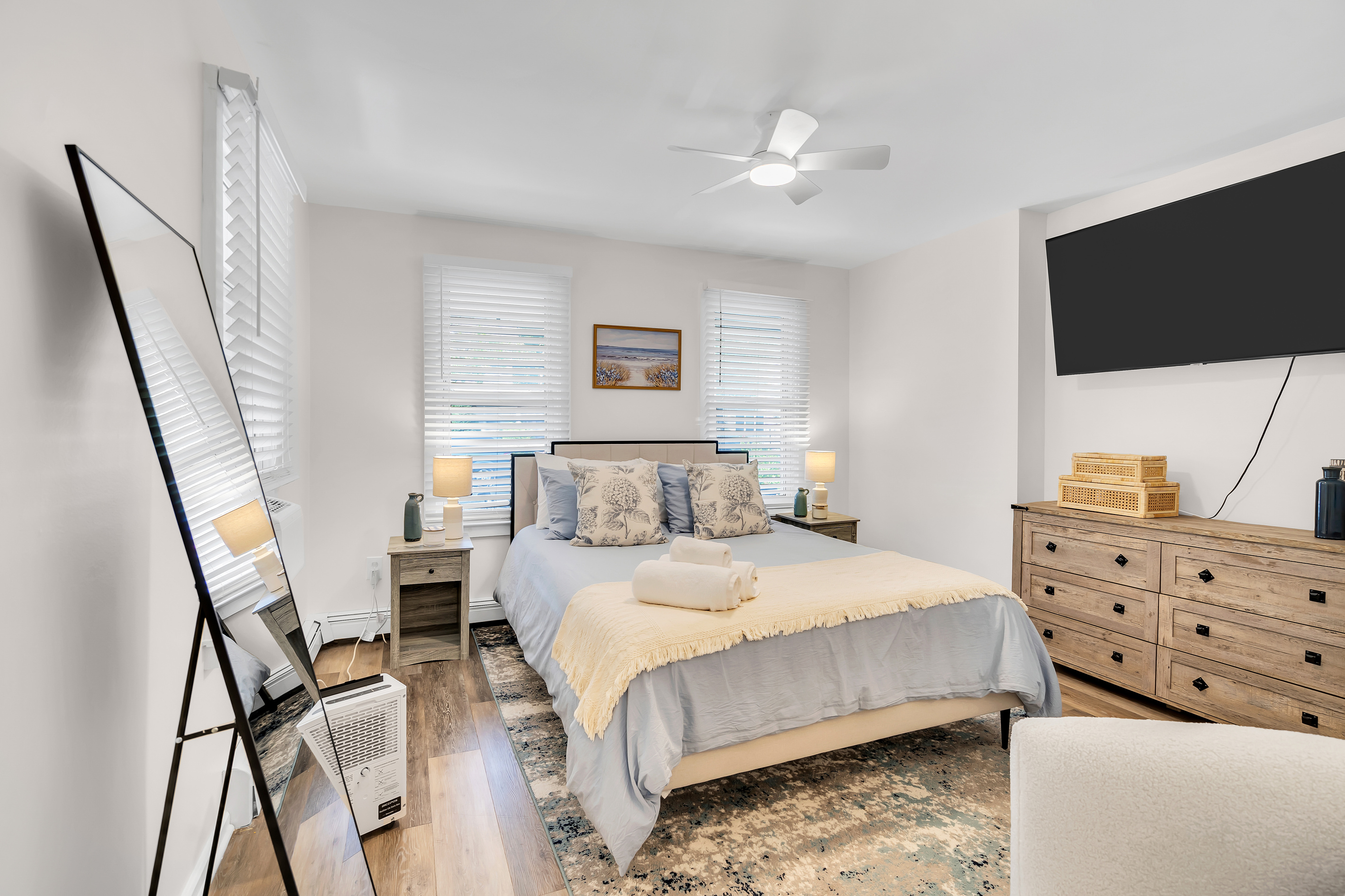 Wake up slow in the queen bedroom. Soft memory-foam bed, a ceiling fan overhead, and your own TV for a lazy start before the day on the shore begins.