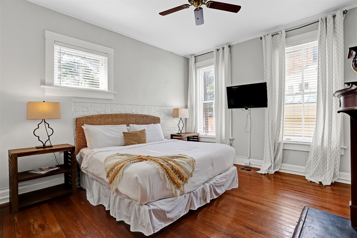 Spacious primary bedroom with a plush king bed for ultimate comfort.