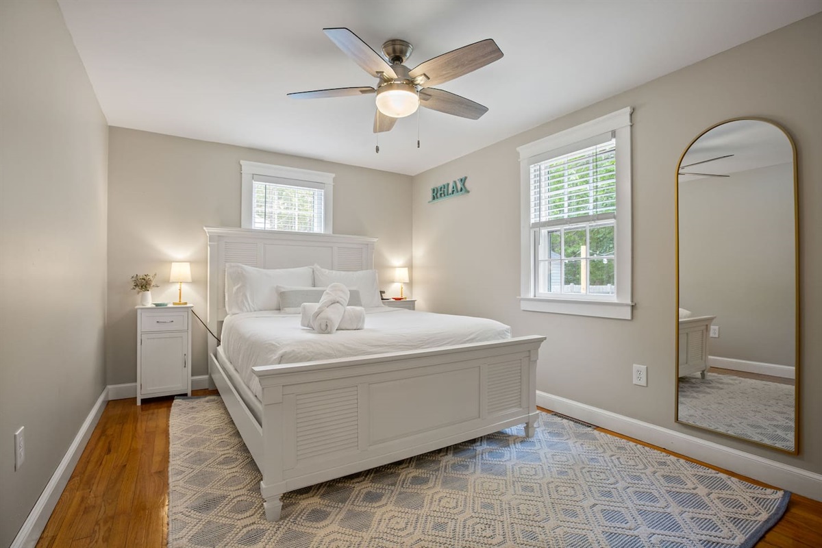 Wake to soft morning light and slow sips of coffee. The queen room is all comfort, calm, and clean lines.