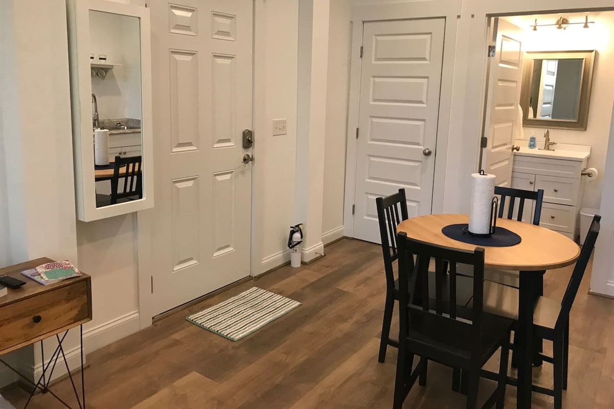 Dining area.  P.S. There's an iron and ironing board in the mirror box :)
