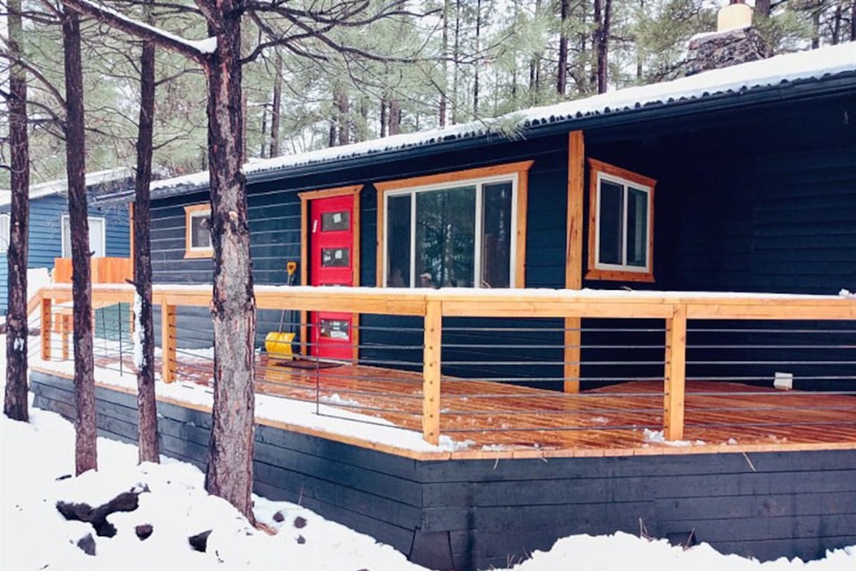 Mid-century modern bungalow with huge porches front and back.