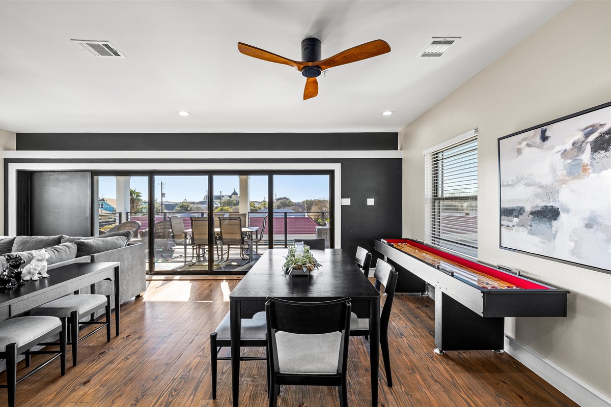 Dining Room: Bright and airy dining space with stunning views and fun game table for endless entertainment!