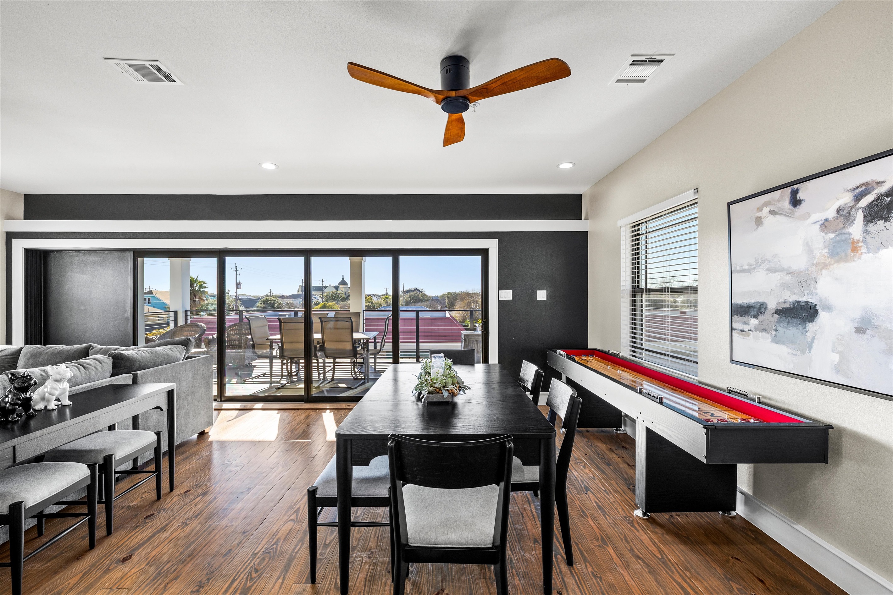 Dining Room: Bright and airy dining space with stunning views and fun game table for endless entertainment!