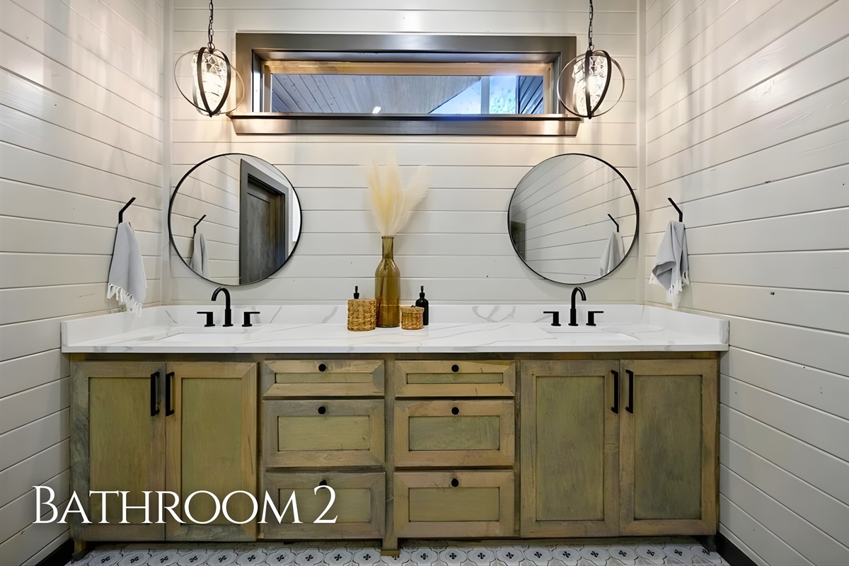 This second bathroom offers plenty of space, charming finishes, and everything you need to feel at home.