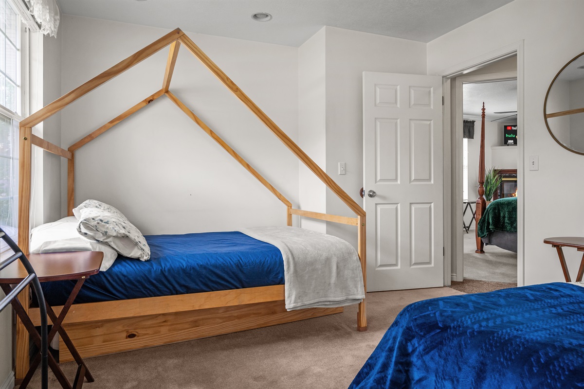 Comfortable second bedroom with a queen bed, double bed, and additional floor mattress