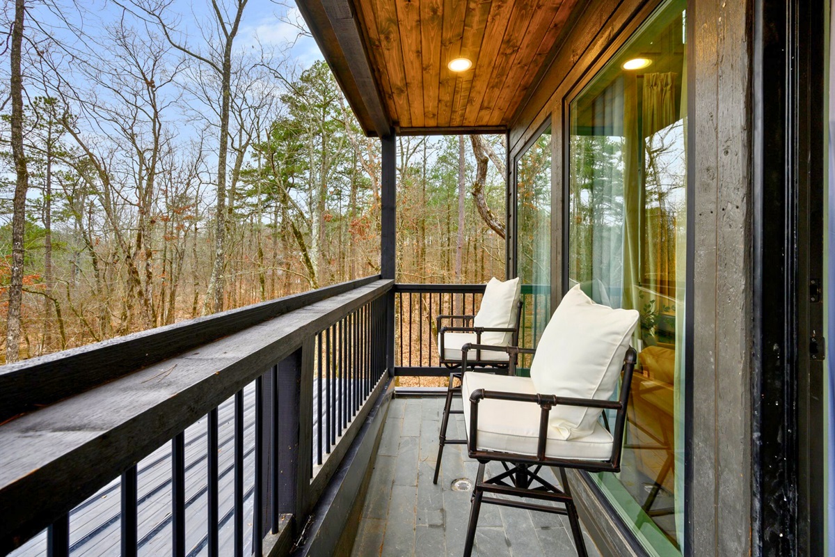 This cozy balcony provides a private place to sit back and enjoy the crisp forest air.