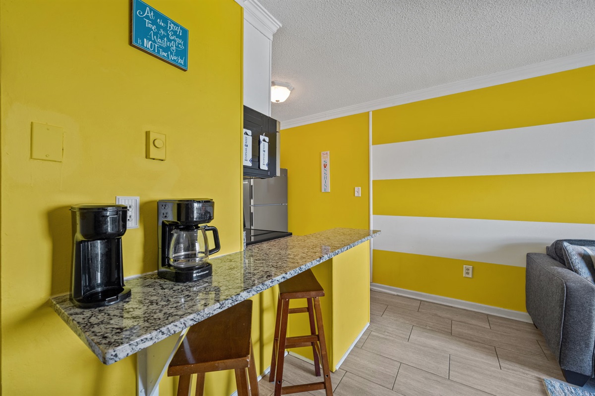 Breakfast bar with stools and coffee station, perfect for quick mornings before heading to the beach