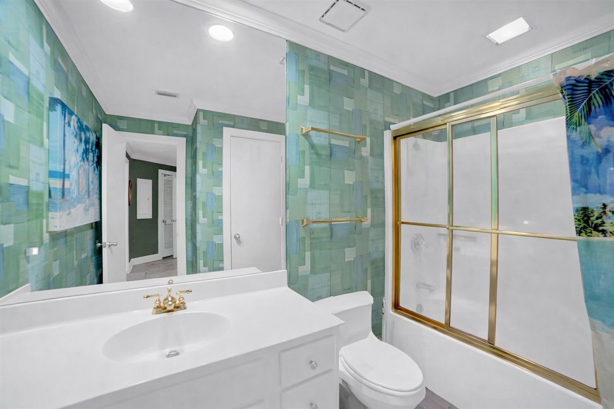 Main bath will have wallpaper removed and walls painted, new vanity with quartz top and a tub/shower combo 