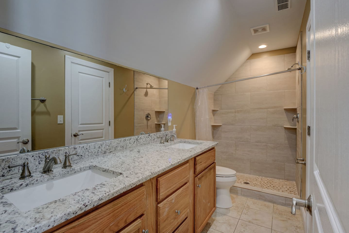 This bathroom is on the top level and shared between Bedrooms 4 & 5