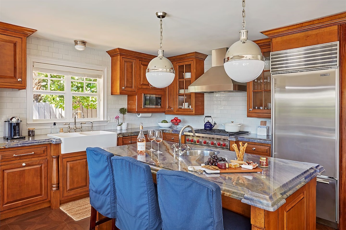 Spacious island with a built-in prep sink and seating for three—perfect for enjoying morning coffee or casual conversations while cooking.