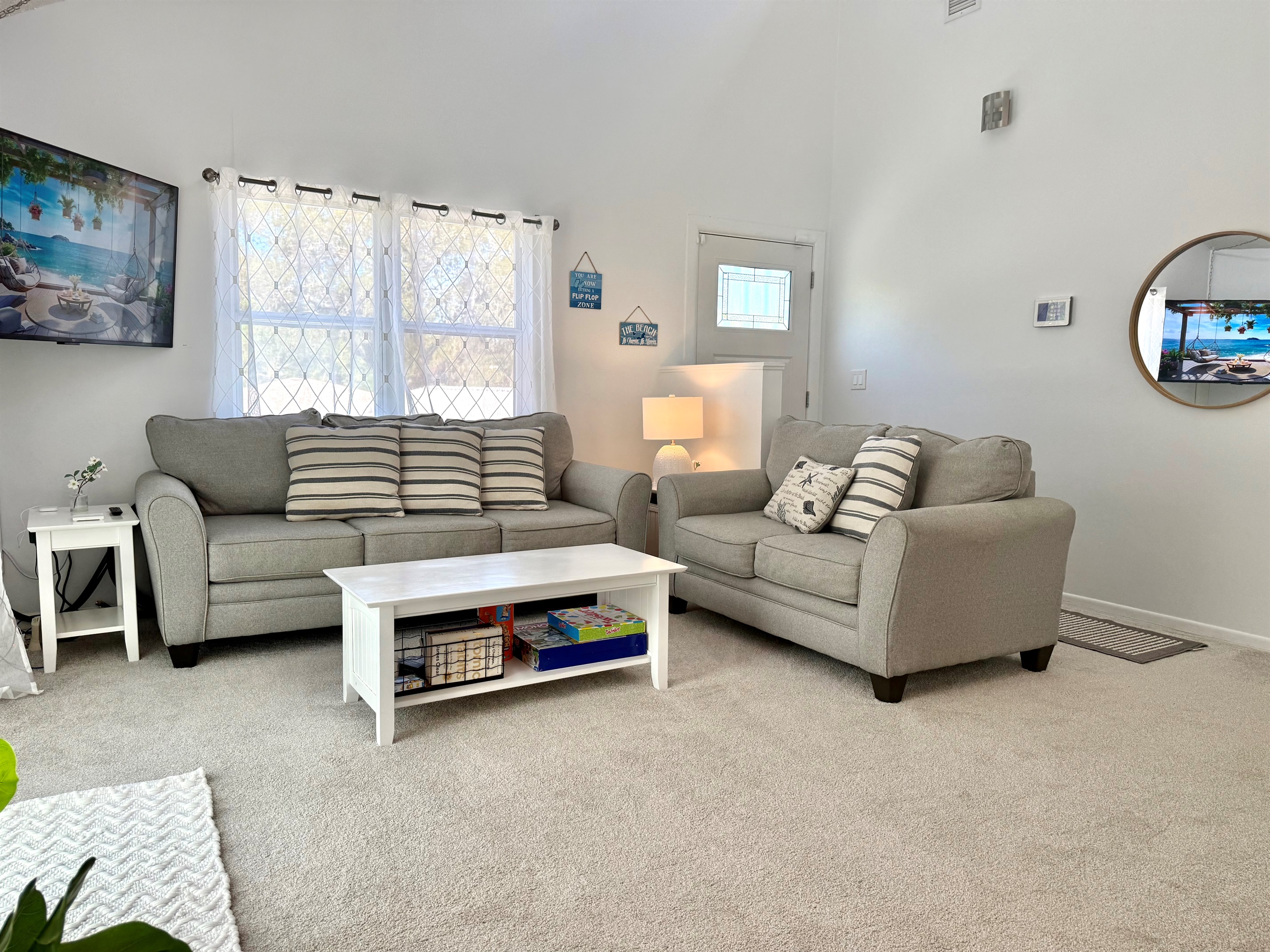 Unwind on the plush sectional sofa, enjoy a favorite show on the flat-screen TV, or simply soak up the calming atmosphere of this cozy space.