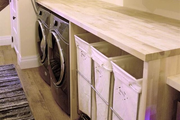 The laundry area provides three separate canvas bags for each guest