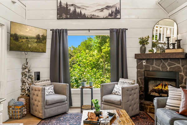 Living room w/ fireplace & TV | 1st Floor