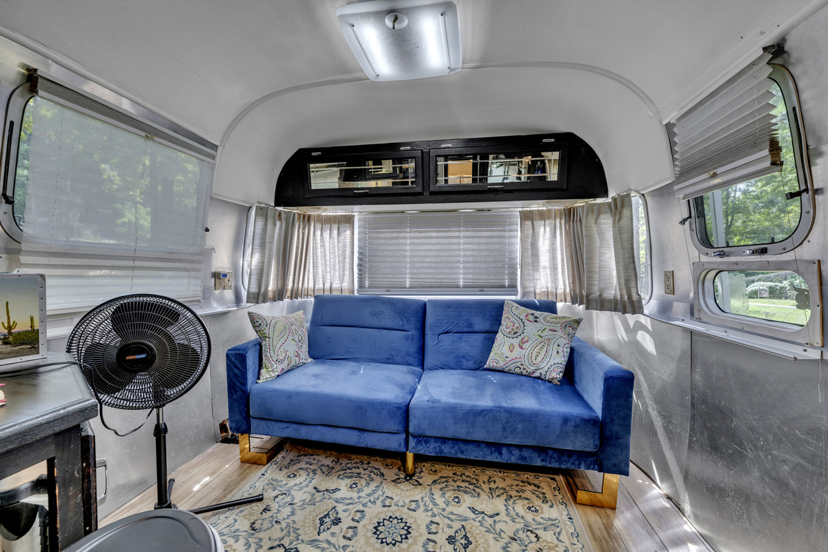 Stretch out and relax in the Airstream’s cozy lounge area