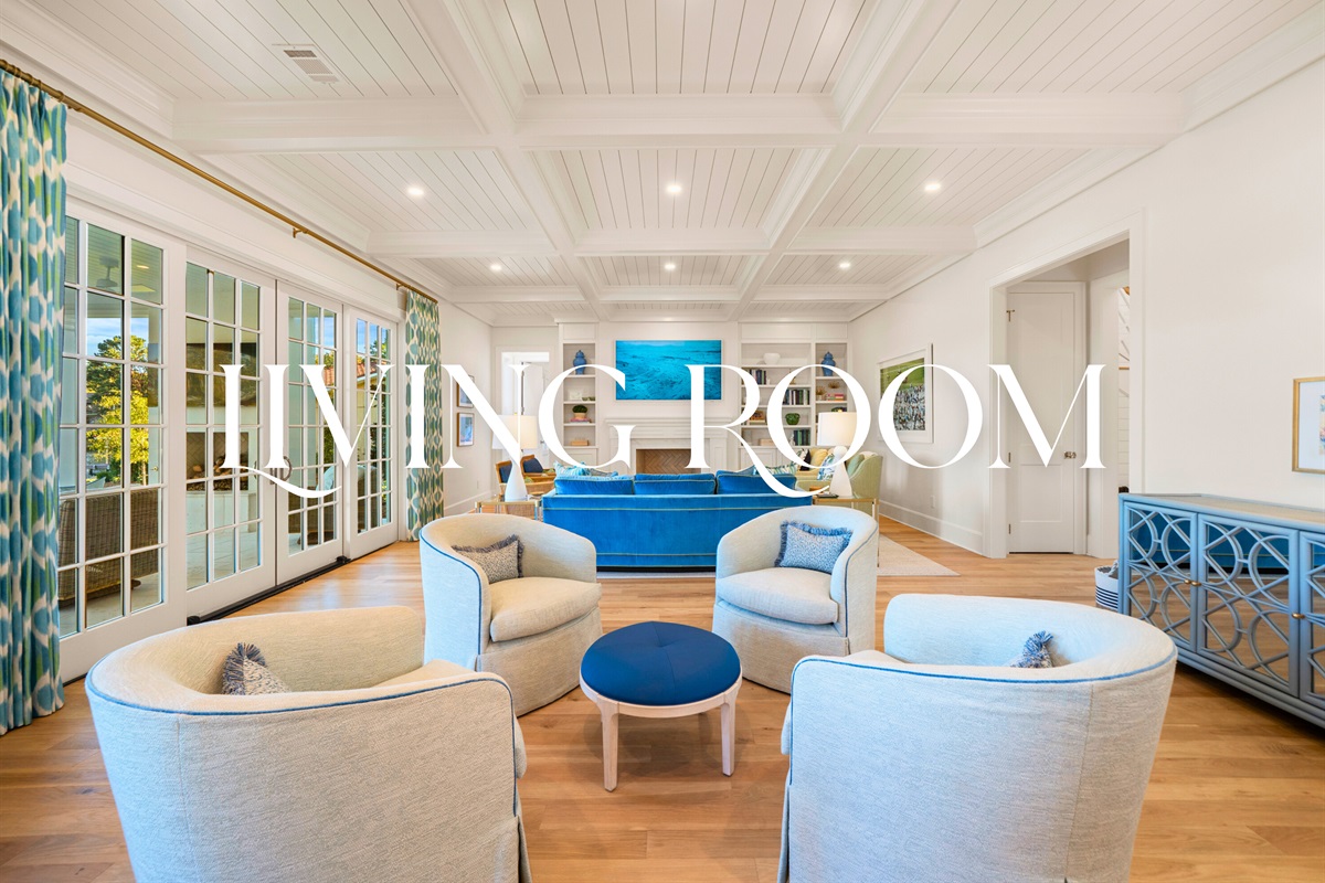 Living room with vaulted ceilings and inviting coastal charm.