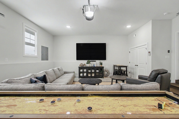 Shuffleboard table and 100" TV