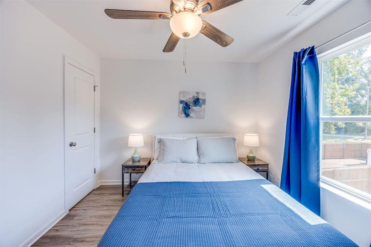 Cozy bedroom with a full bed and a convenient closet for your storage needs.