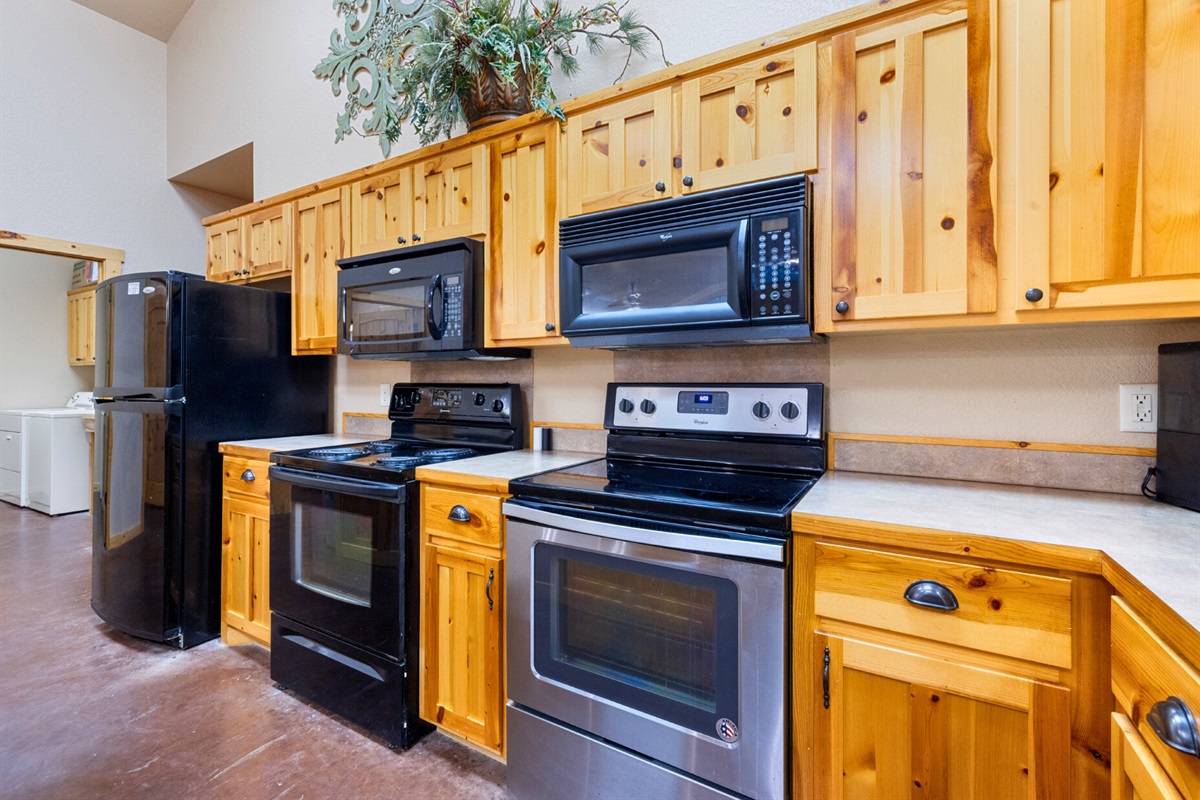 A well-equipped kitchen with double ovens and ample counter space makes hosting effortless and fun.