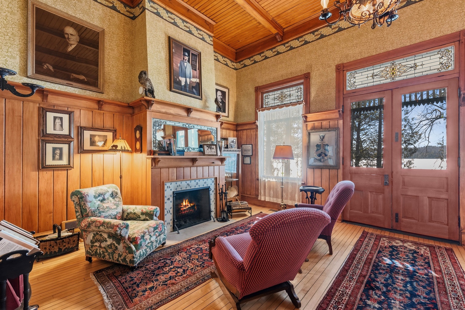 Rustic kitchen w/ wood cabinetry & windows bringing in natural light