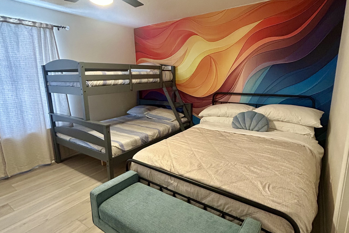 Second bedroom with a King bed and a twin over full bunkbed on second floor