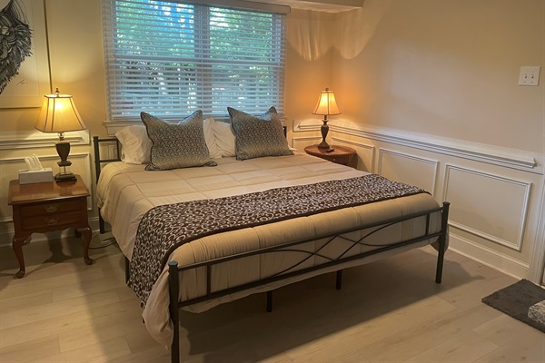 Lower primary suite offers a huge space for relaxing and enjoying your stay. A wonderful king sized bed makes for a great night's rest.