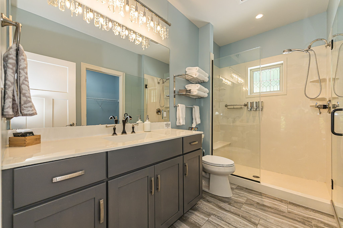 Second full bathroom with vanity and walk-in shower.