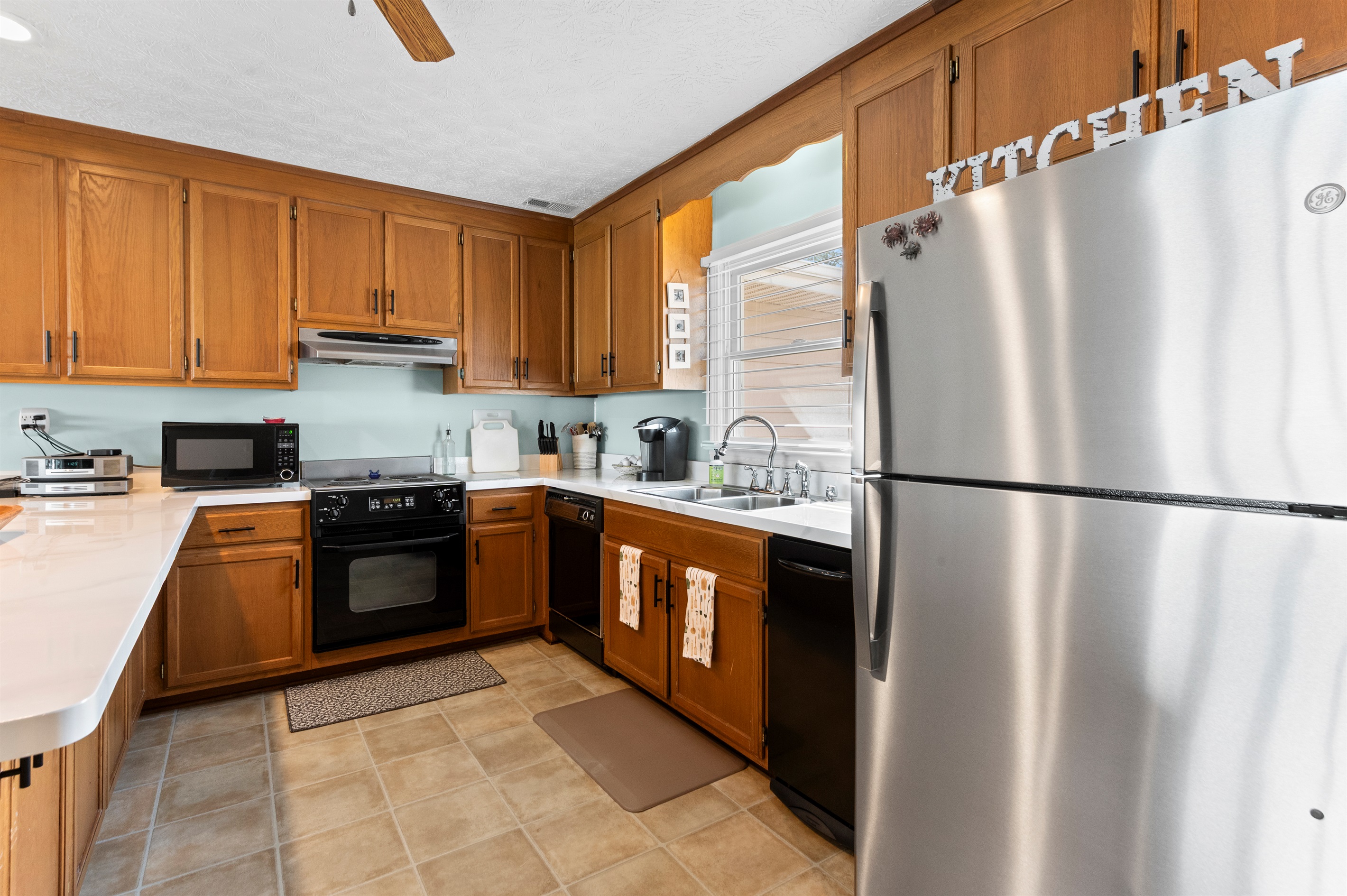 Kitchen: Cook up memories in this well-equipped space with modern appliances and warm wooden accents!