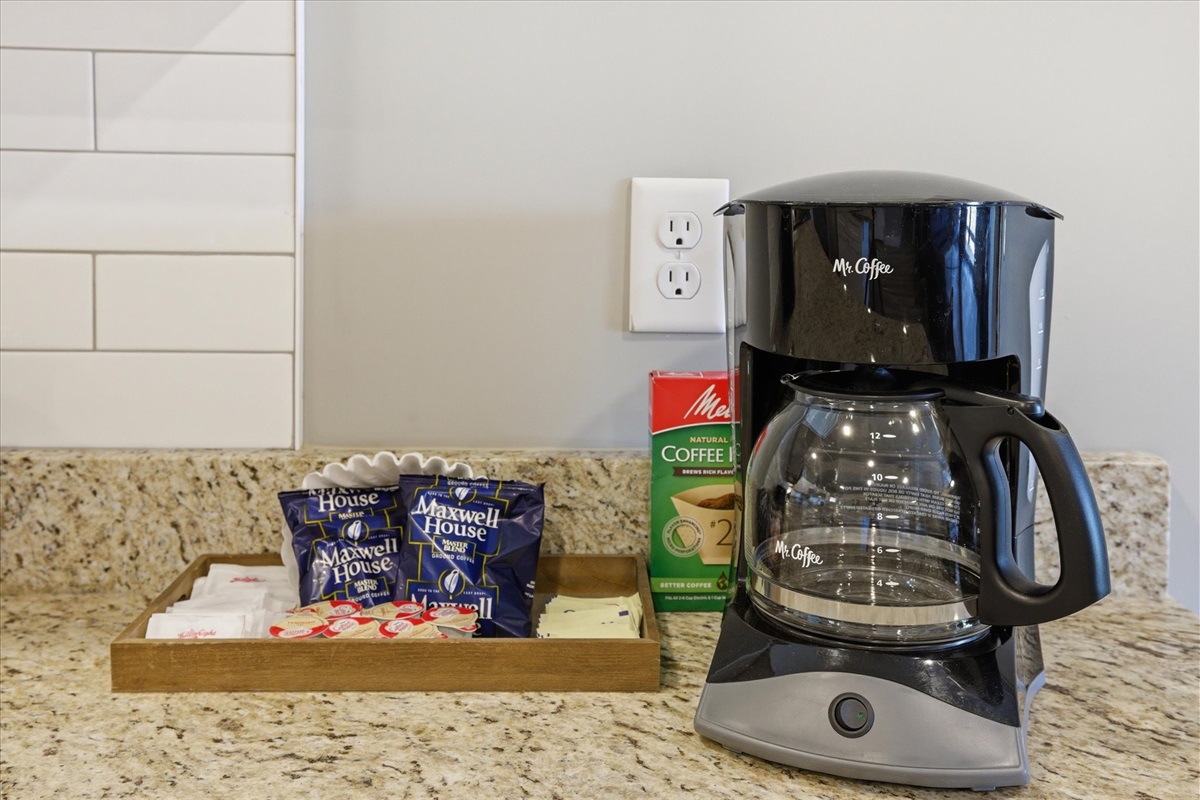 In every unit at the Clubhouse Lodge, the kitchen is where your day gets going—brew a cup, lean into a slow morning, or grab something quick before heading out. It’s simple, but it sets the tone.