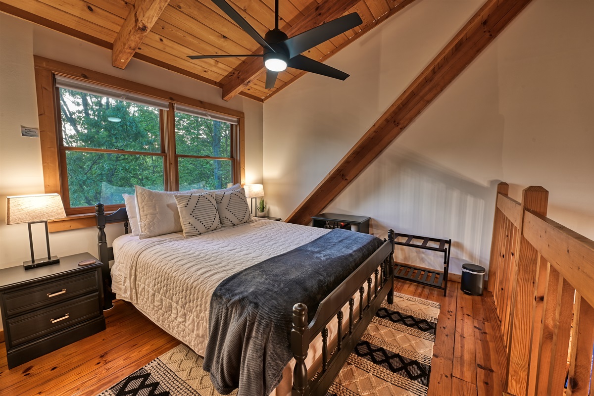 Loft queen bedroom with incredible mountain view.