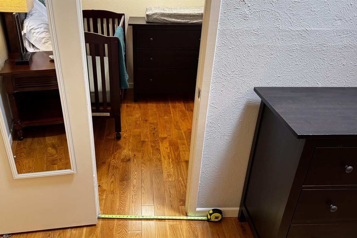 King 2 Suite looking into the baby room with baby essentials.