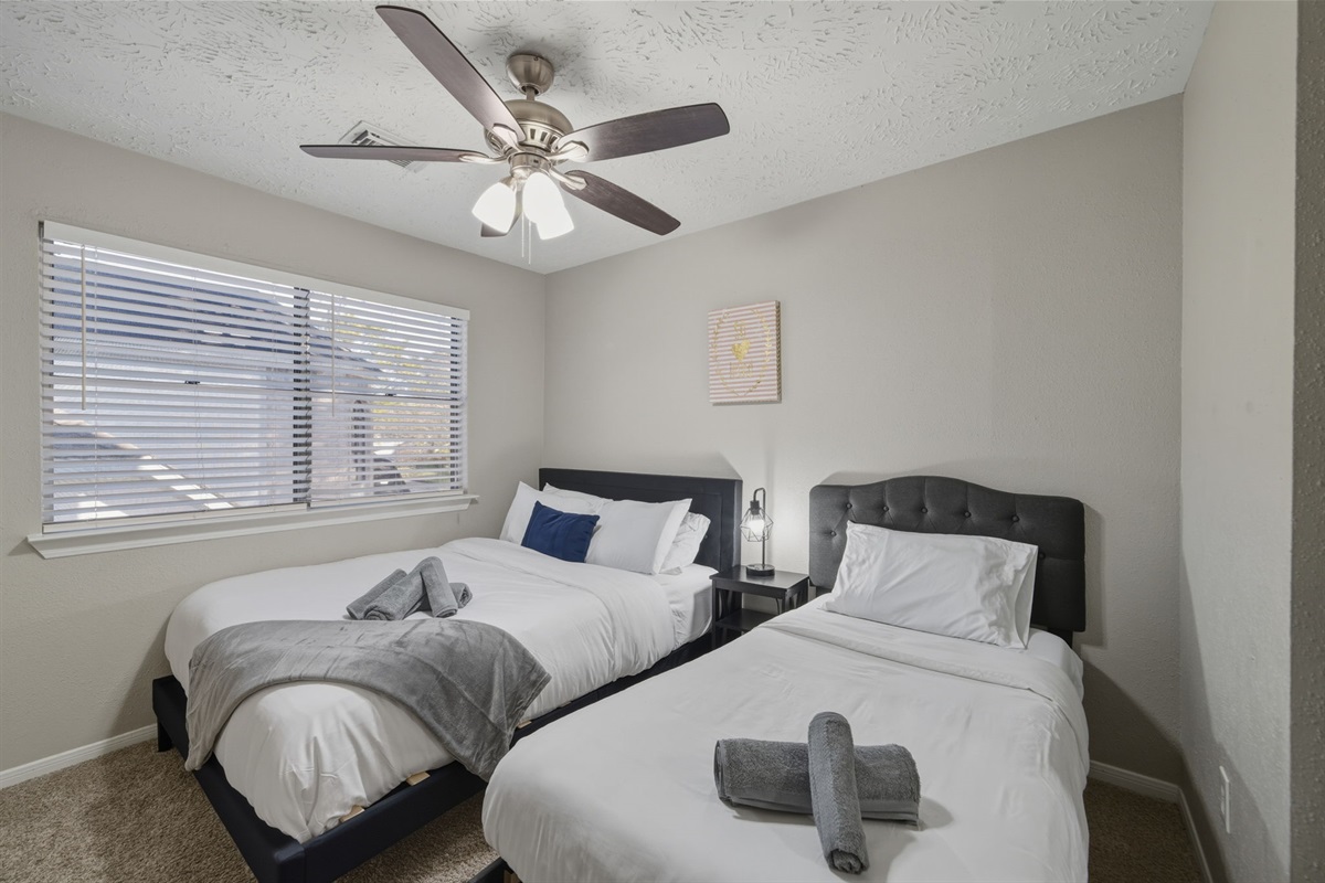 Versatile room with queen and twin beds.