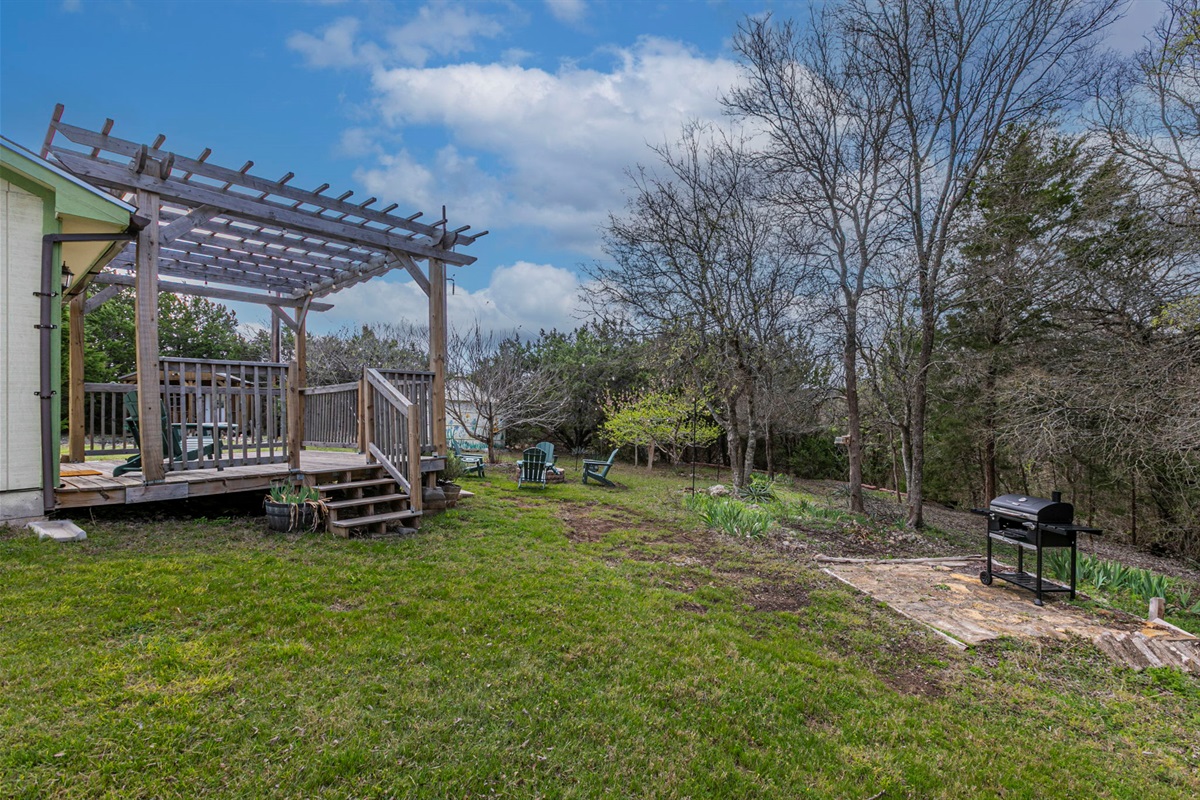 Charcoal grill and peaceful back deck.