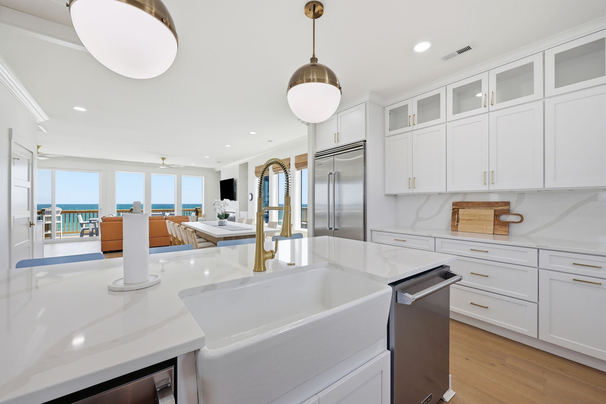 Chef-grade range and hood designed for serious cooking in a luxury coastal kitchen