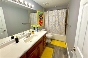 Full bathroom right beside the queen bed at the Kids zone