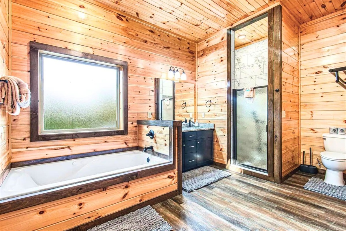 Ensuite Bathroom with Deep Soaking Tub, Walk in Shower and Bright Lighting