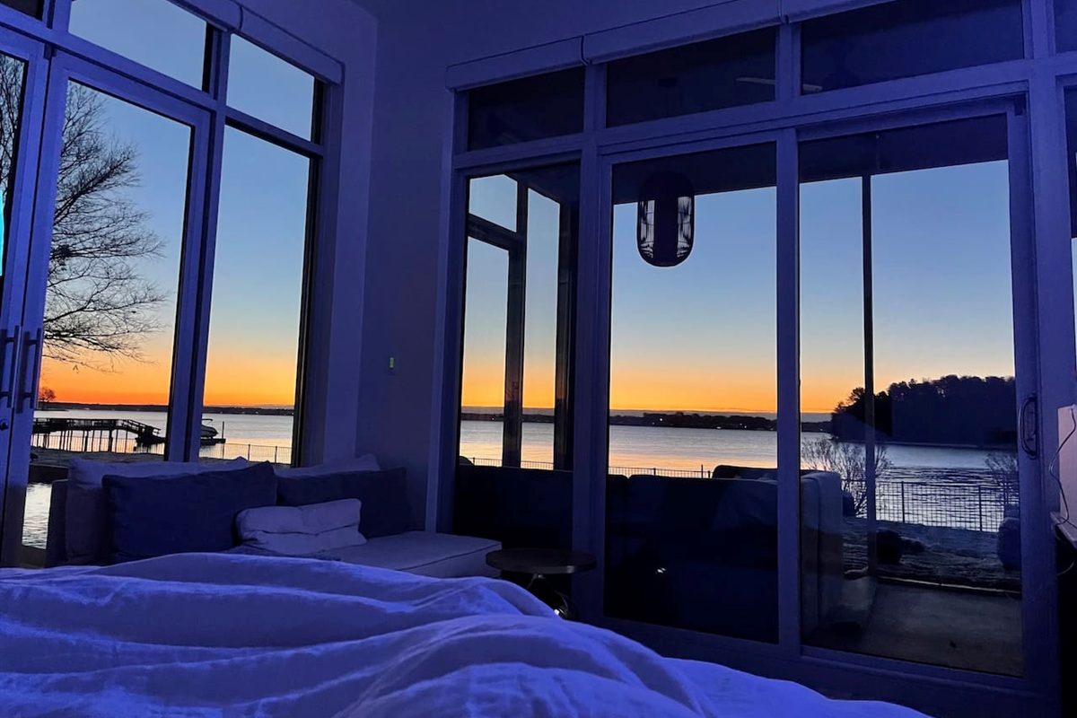 Enjoy sunrises from the master bedroom with electronic shades that can be controlled from your bed.