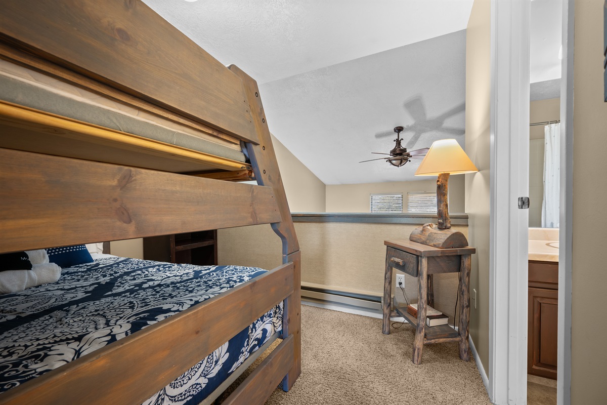 Bunk room with sturdy wooden bunk beds, ideal for kids or additional guests.