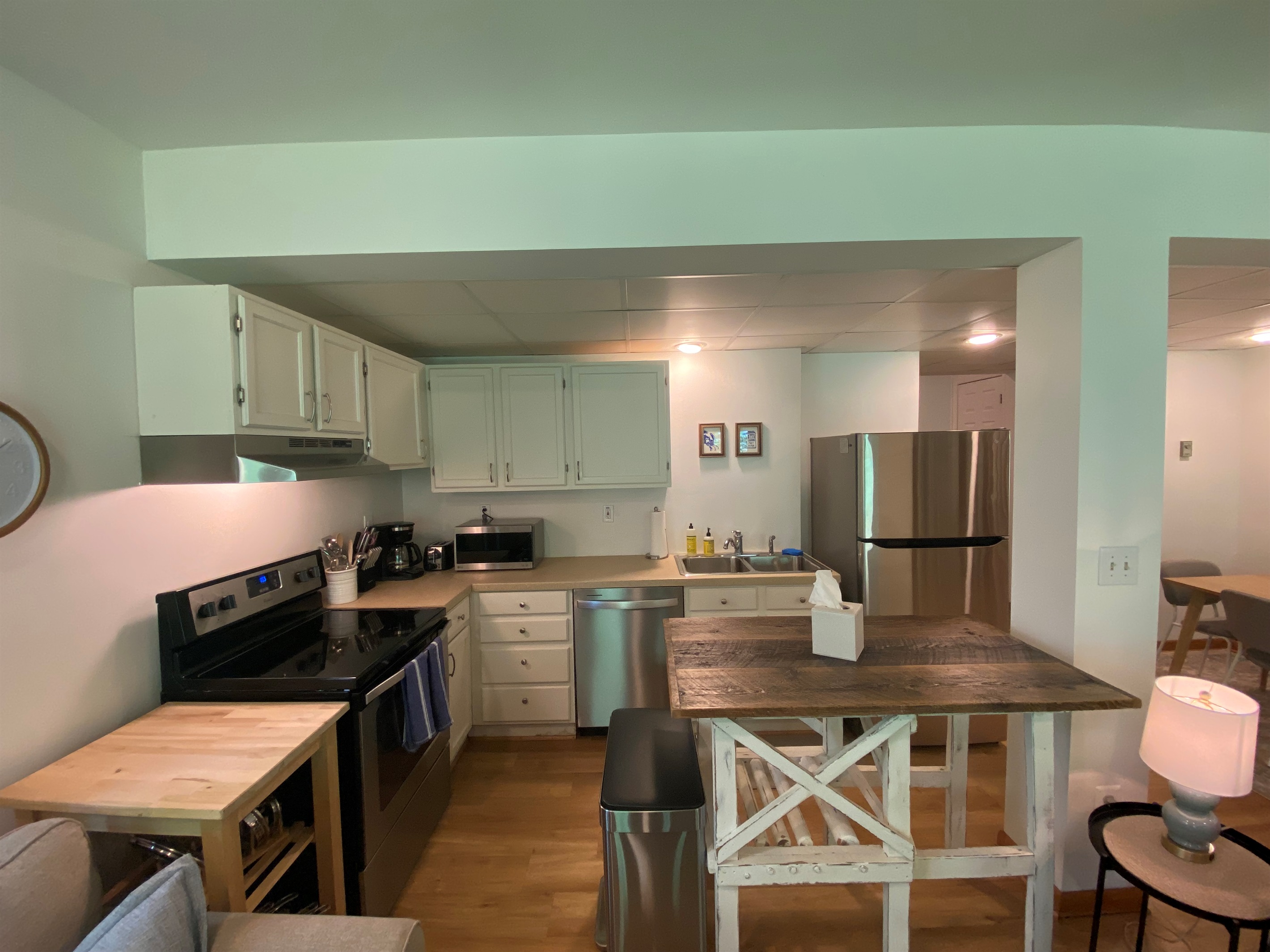 An island and countertop extender provide additional surfaces for organizing and cooking