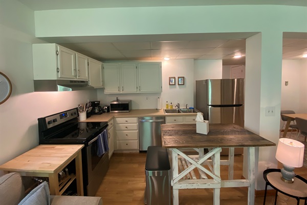 An island and countertop extender provide additional surfaces for organizing and cooking