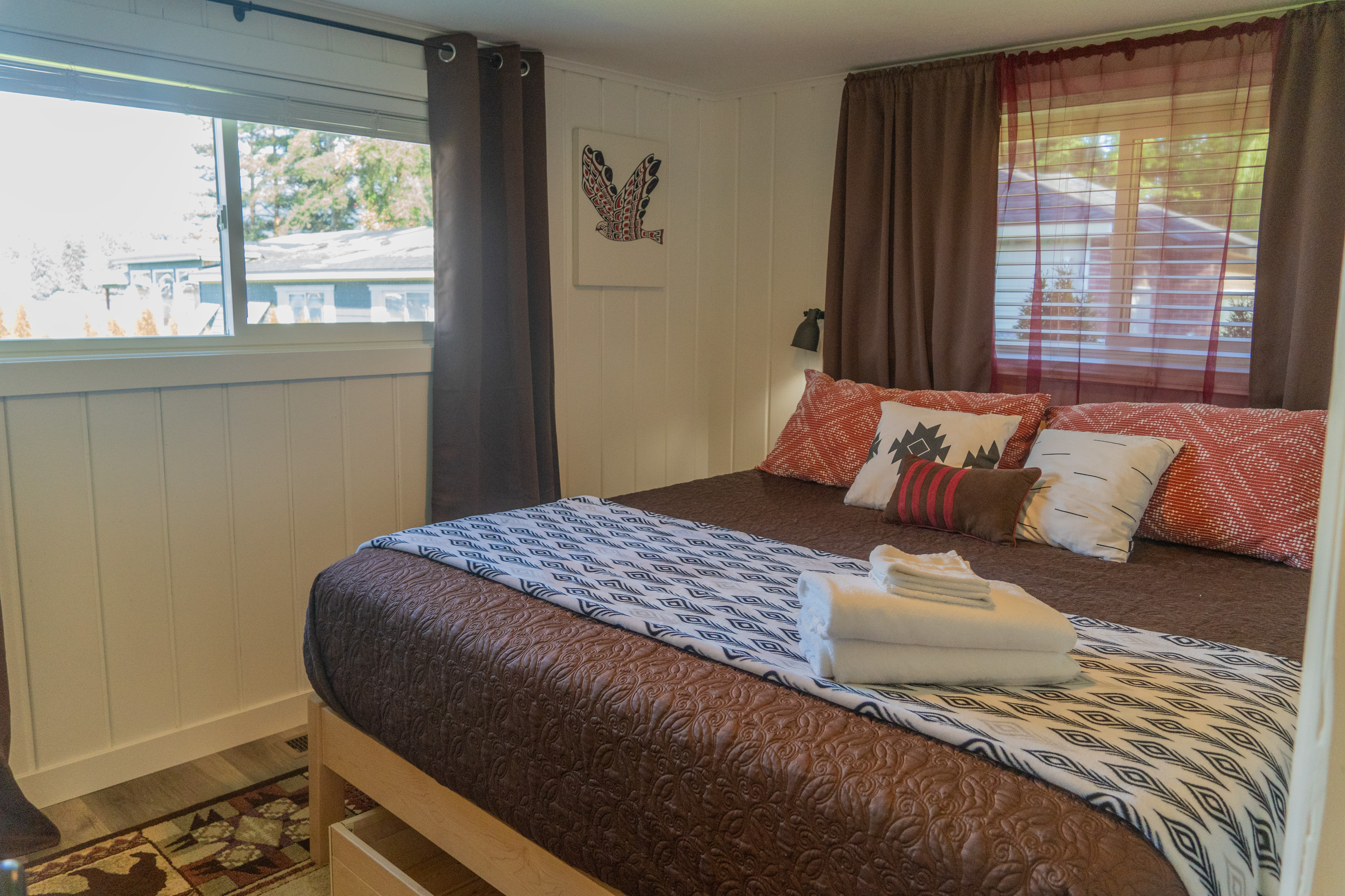 From the master bedroom, the window frames a serene view of the lake, bringing natural calm and a peaceful connection to the outdoors into the room.