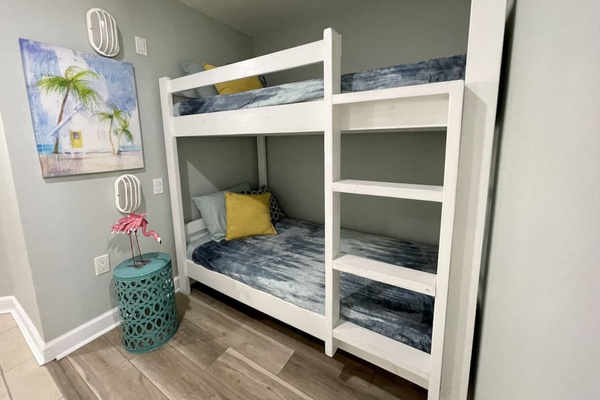 Twin bunk beds located in hallway alcove. 