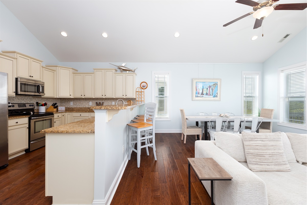 Open-concept layout connects the living area and kitchen